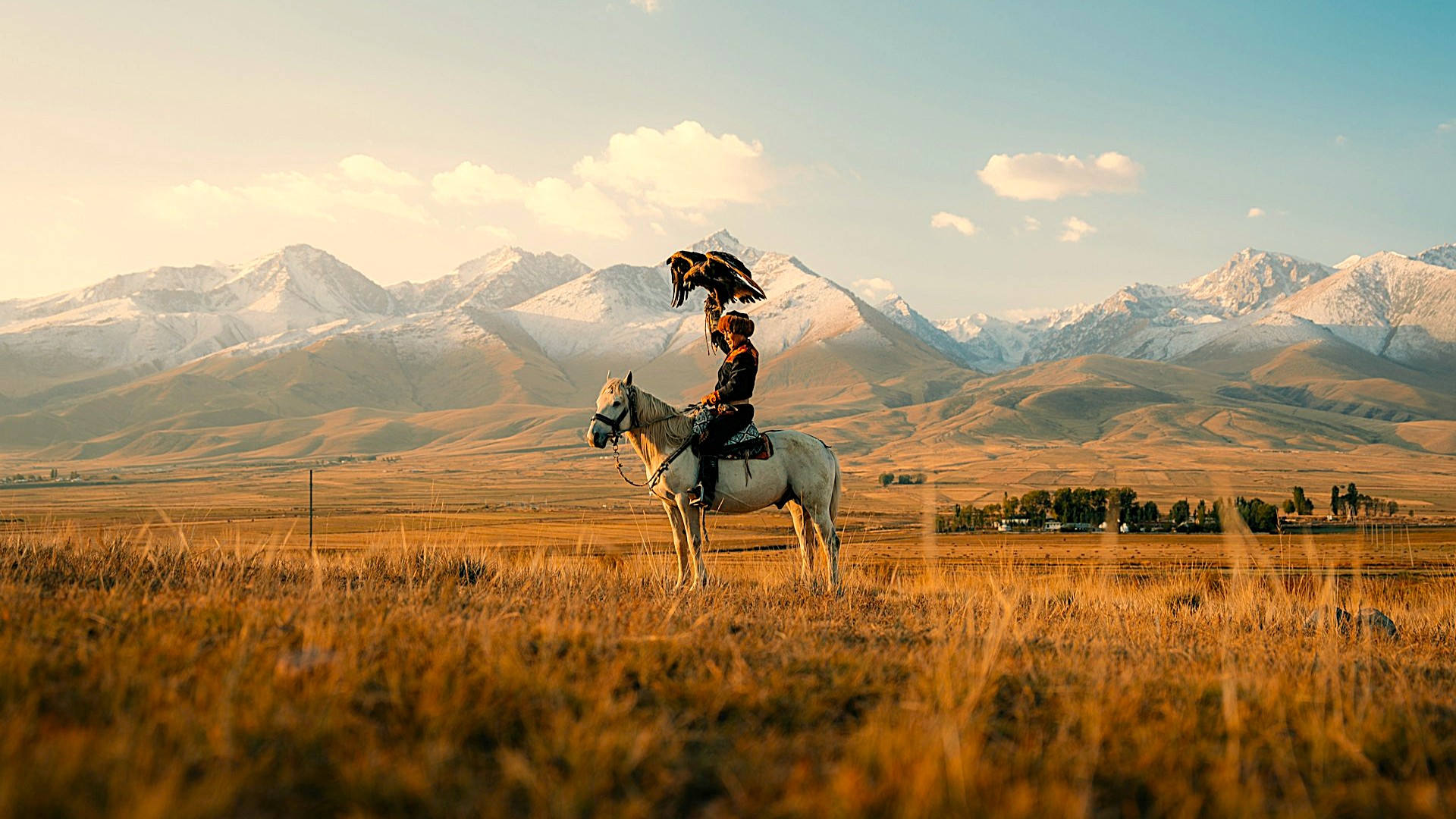A traditional eagle hunter (Berkutchi) on horseback in Kyrgyzstan. Photo by Spenser Sembrat