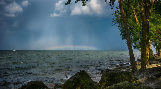 A small rainbow on Lake Erie. Cleveland, Ohio, USA. Photo by Dick Pratt
