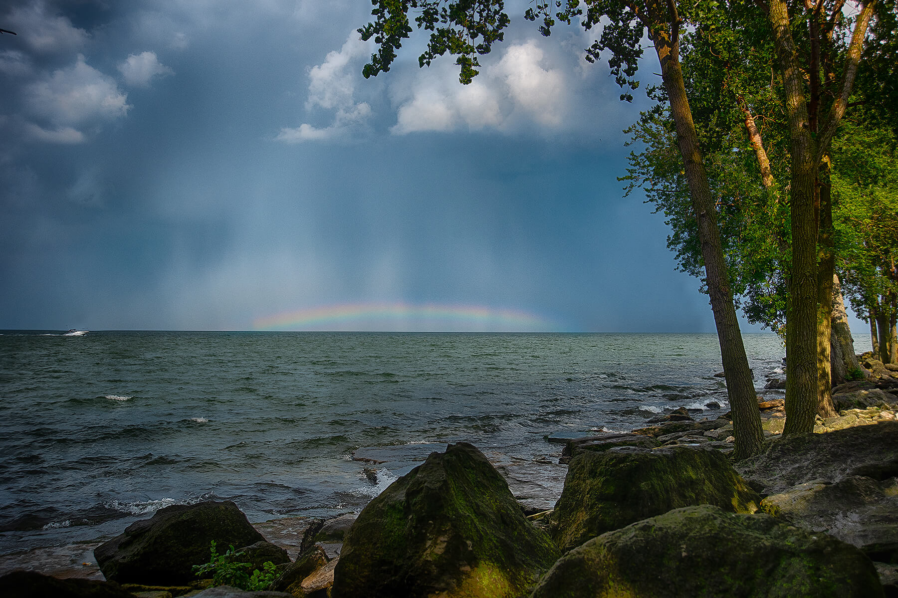 A small rainbow on Lake Erie. Cleveland, Ohio, USA. Photo by Dick Pratt