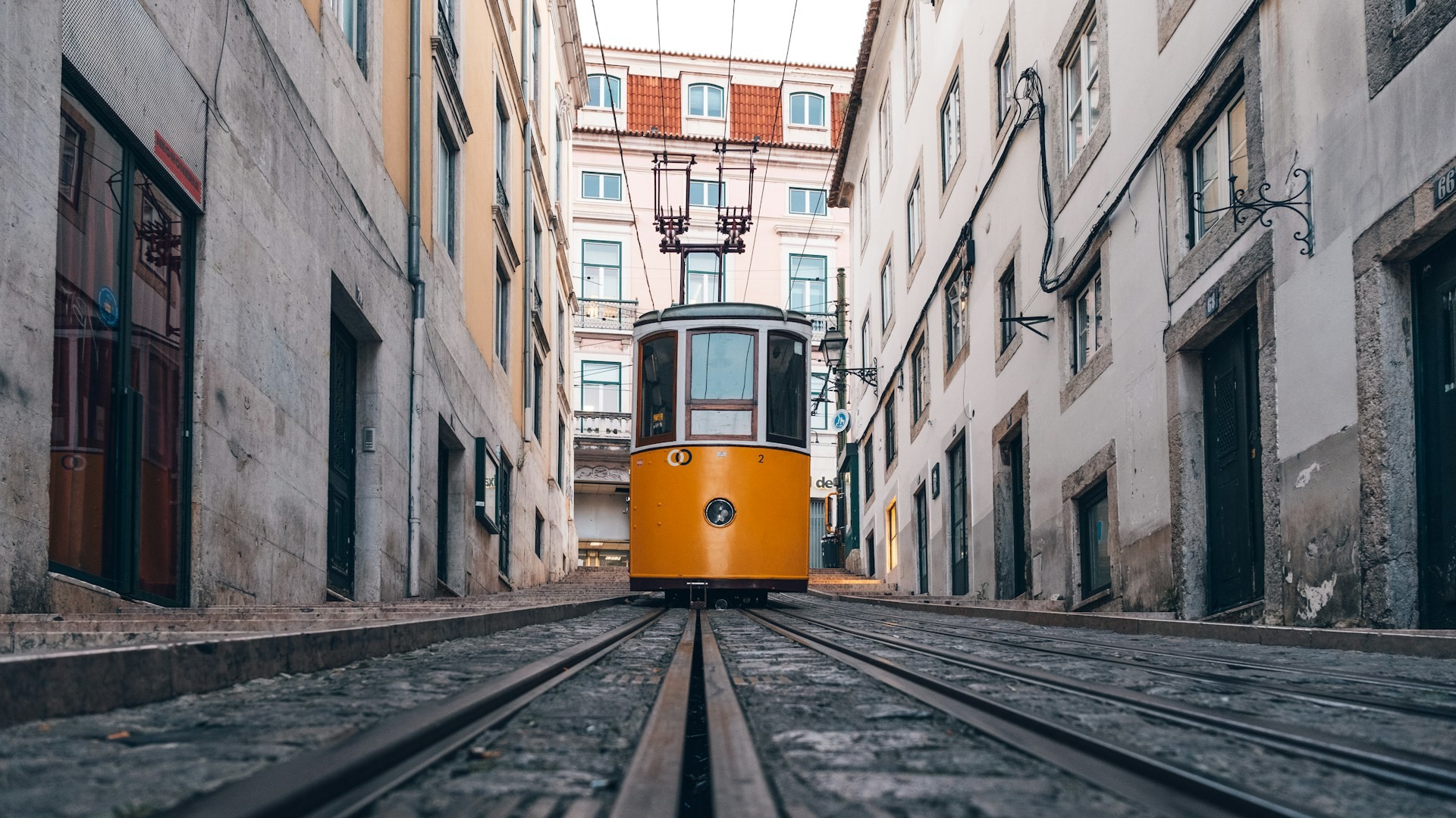 The iconic yellow Elevador da Bica (Bica Funicular) in Lisbon, Portugal. Photo by Philipp Düsel