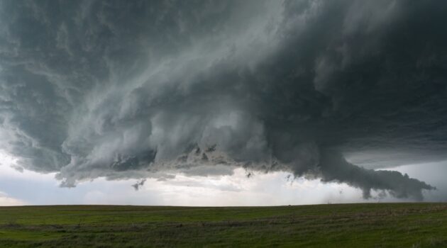 A supercell with an inflow tail hovers over fields in eastern Colorado. Burlington, CO, USA. Photo by Steve Gribble